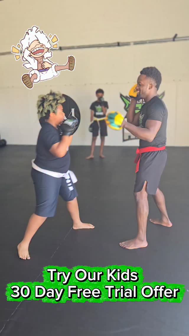 Young student training MMA pad work with Sodiq at the Waldorf academy